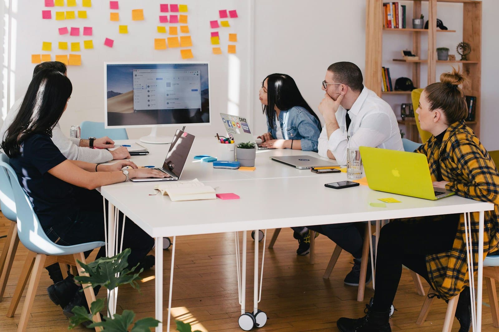 A small team working through documents at a table